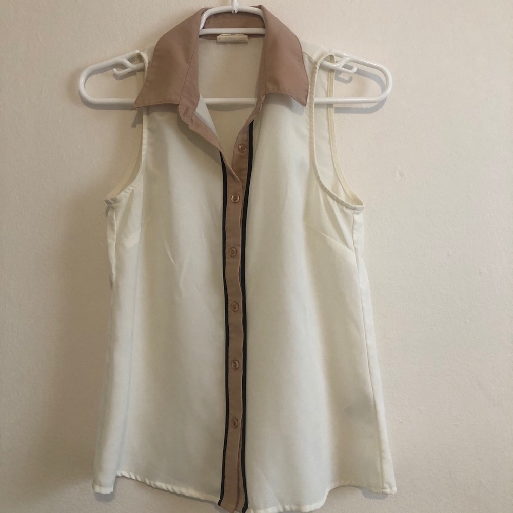White, tan and black blouse
